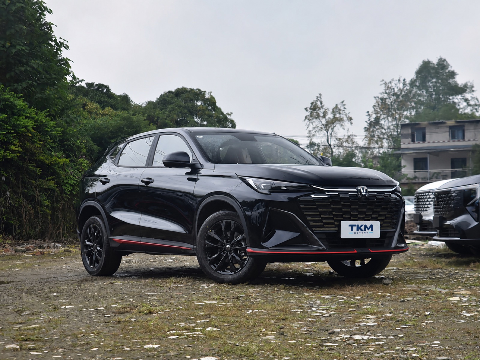 Black Changan X5 PLUS with a TKM Motors plate in a front three-quarter view