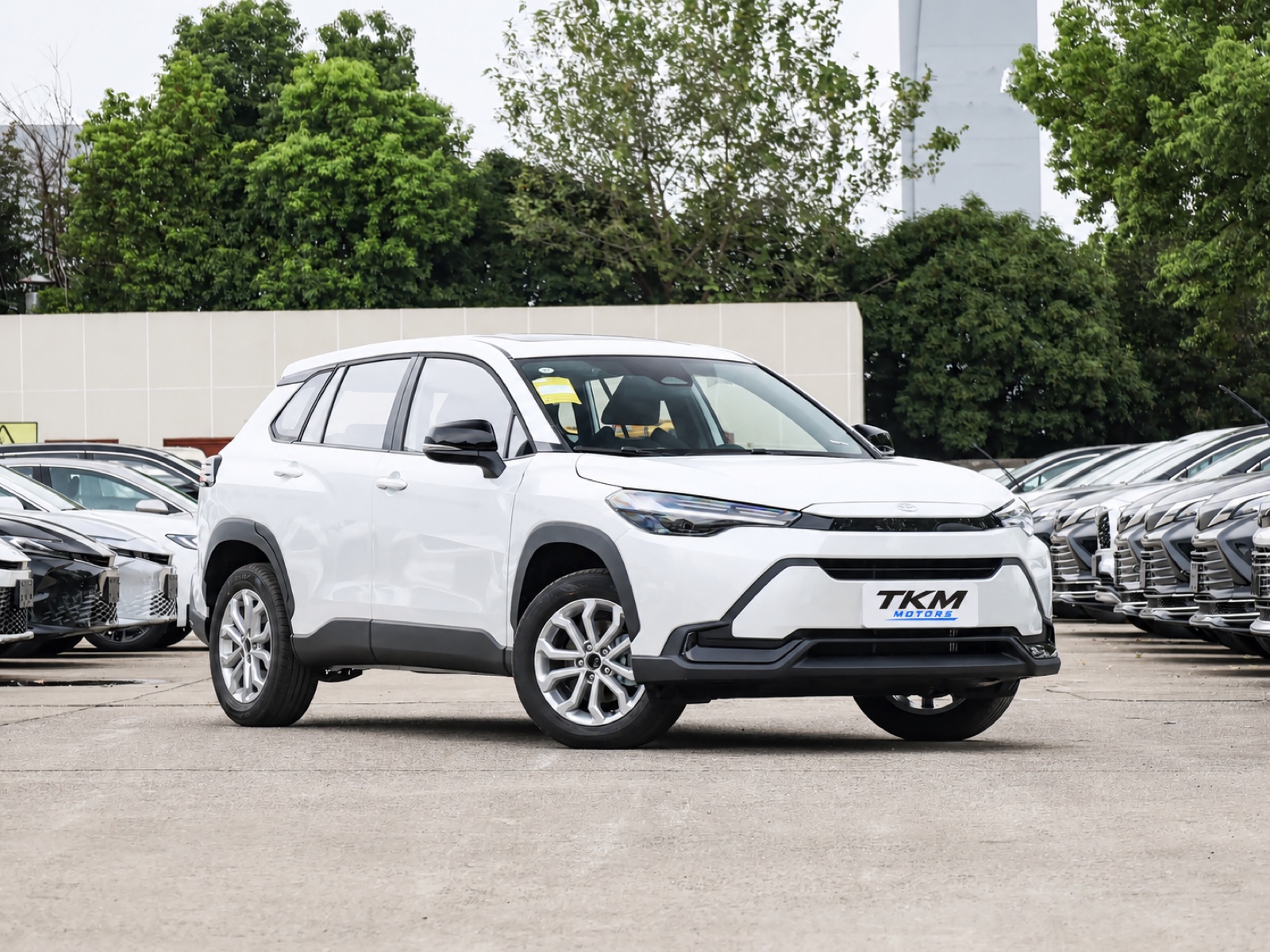 White Toyota Frontlander with a TKM Motors plate in a front three-quarter view